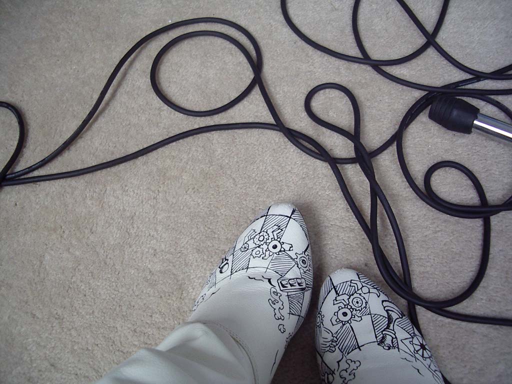 Cogwheel boots and wires on a carpet